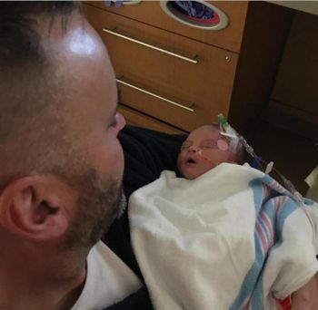 Corey's father reported that Remi is doing well despite her early arrival.